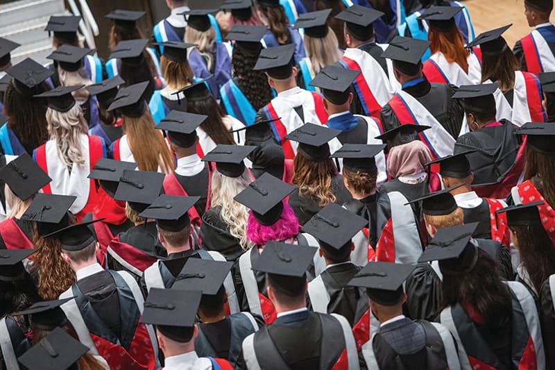 Graduates celebrating university-level awards